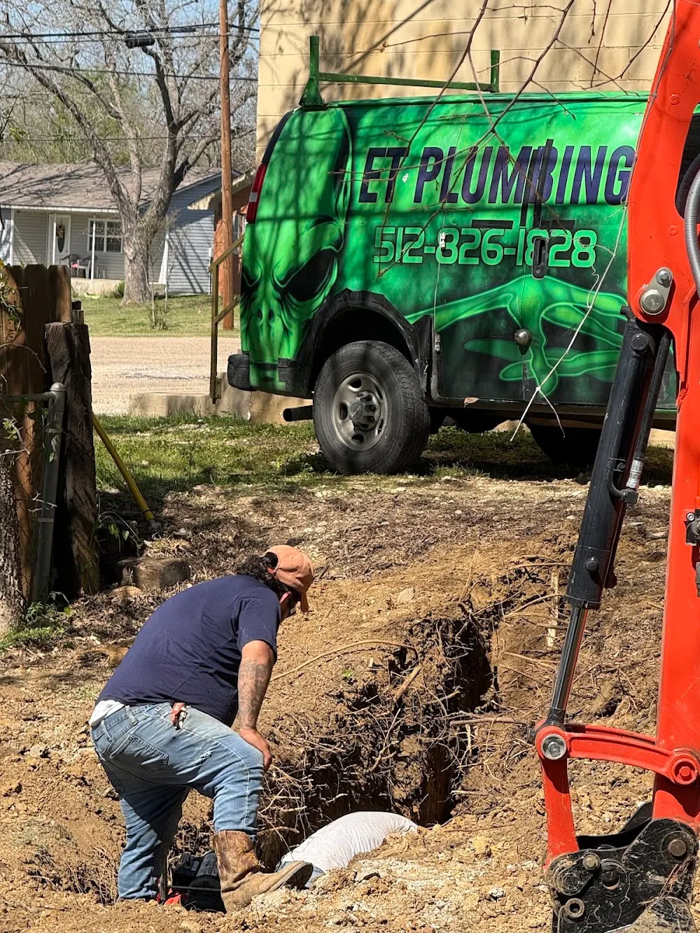 ET Plumbing technician working on an underground line